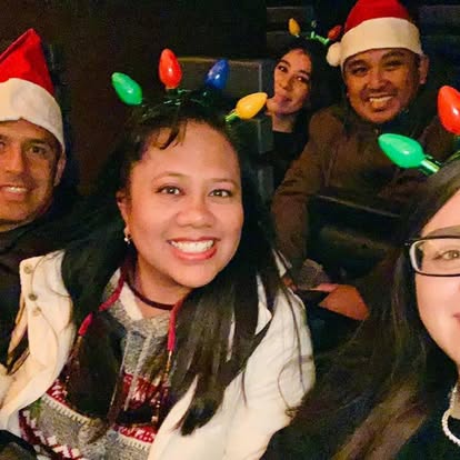 Holiday celebration with team in Santa hats